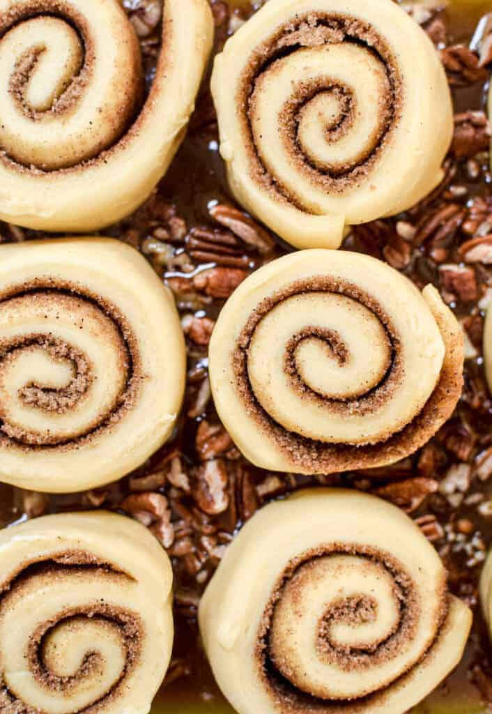 dough pinwheels on top of walnuts 