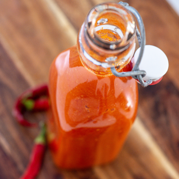 a close up angled birds eye view of the bottle of chili sauce