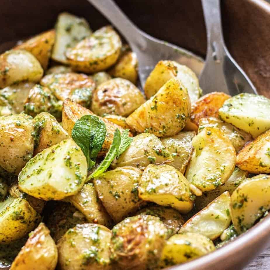 roasted potatoes tossed in green dressing