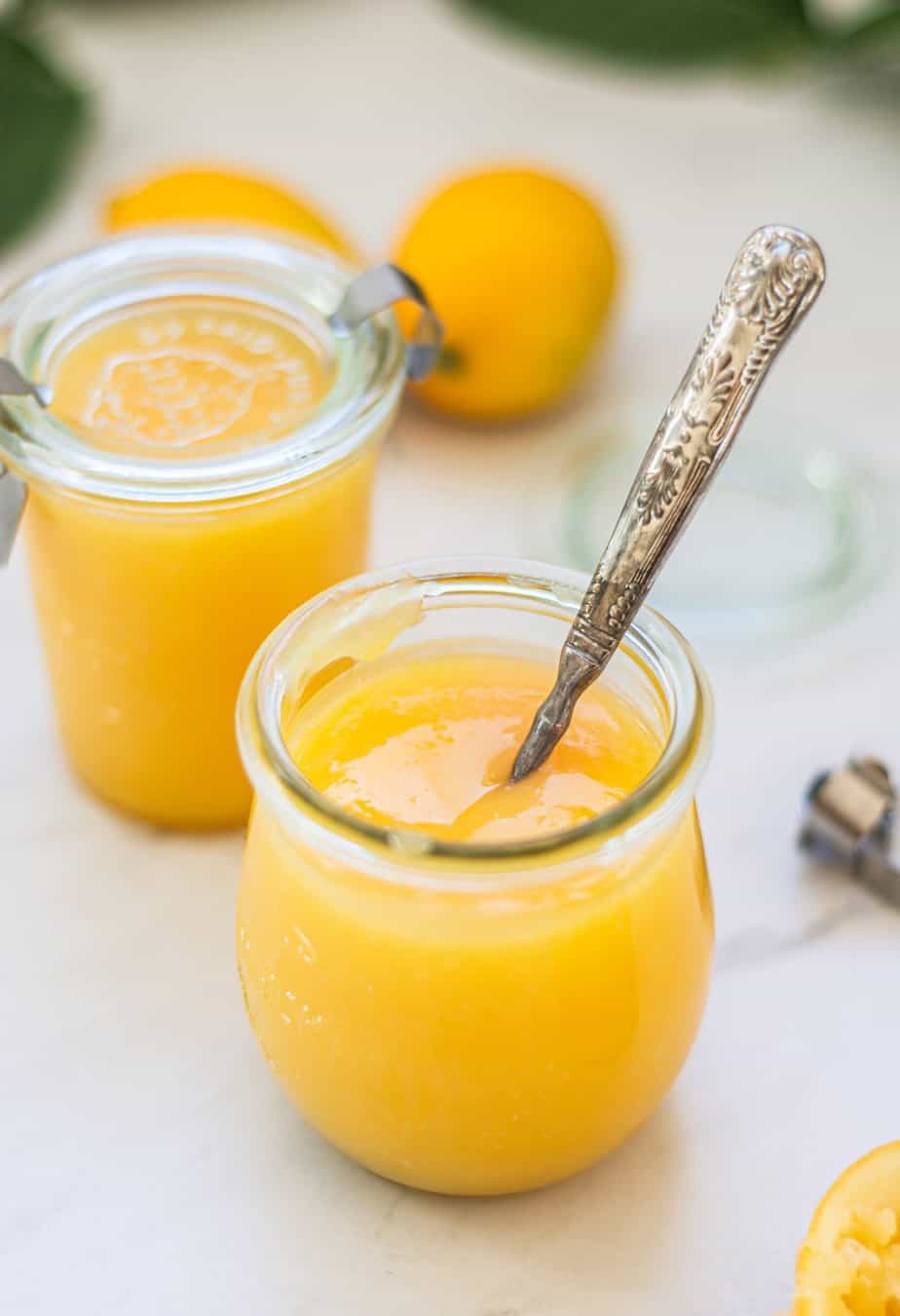 two jars of yellow lemon curd