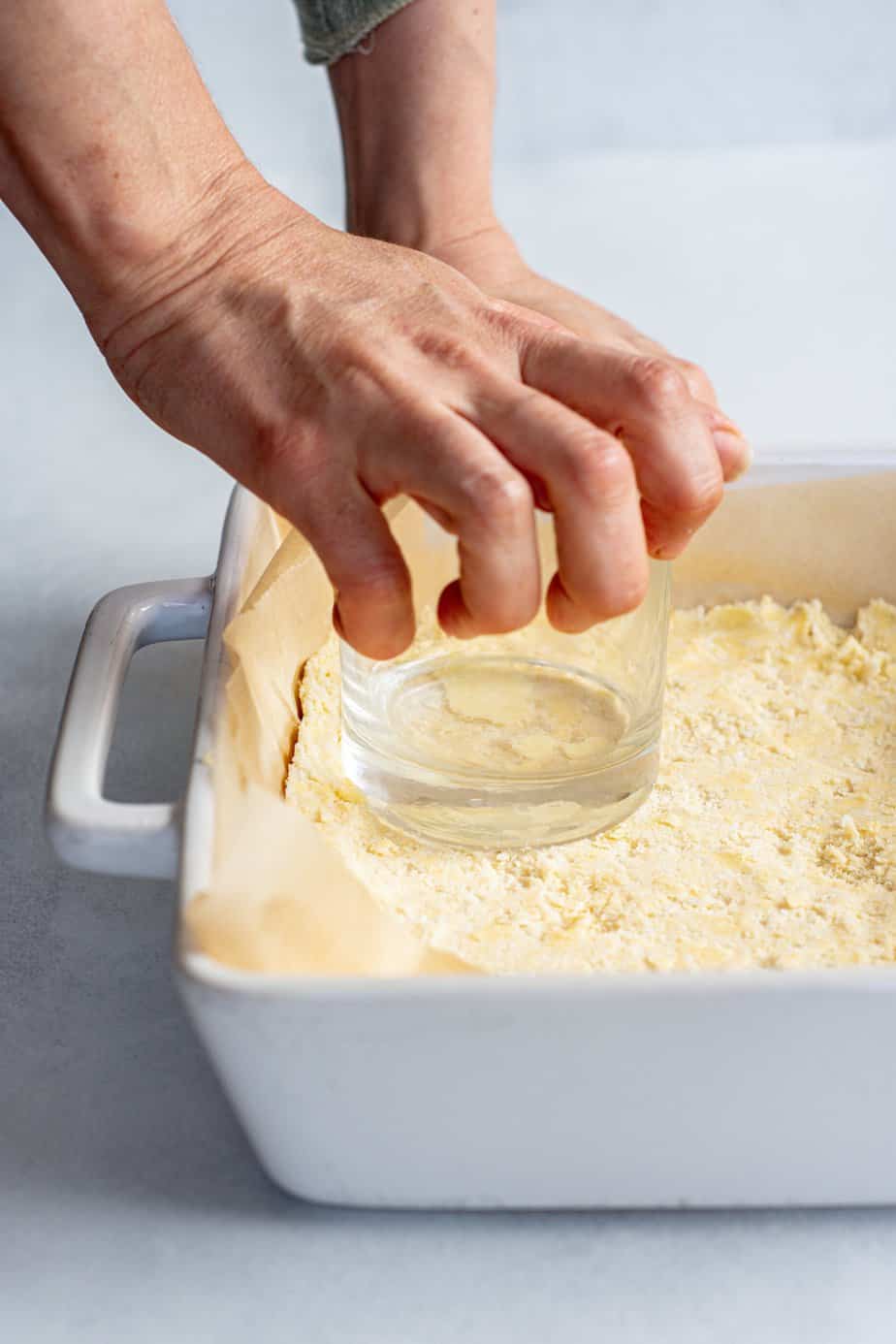 a glass pushing shortbread dough down