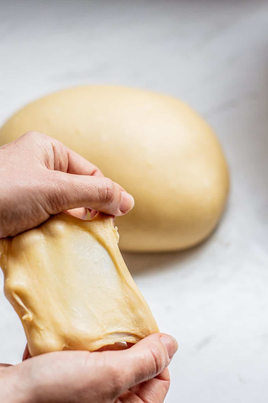 dough being stretched