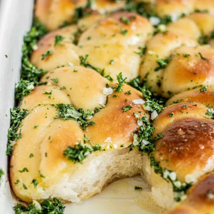 parsley and garlic covered bread knots.