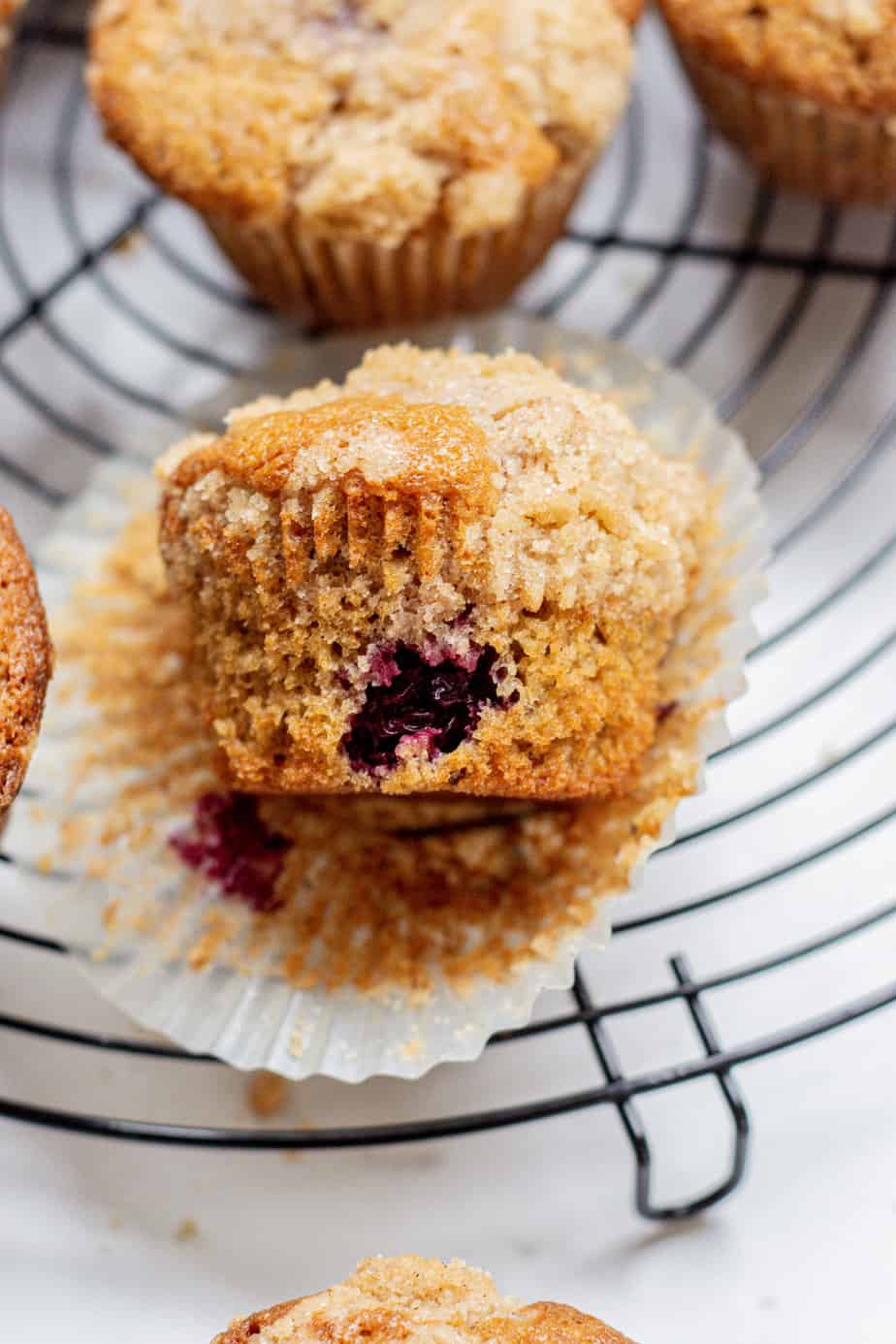 blackberry muffin on a rack.