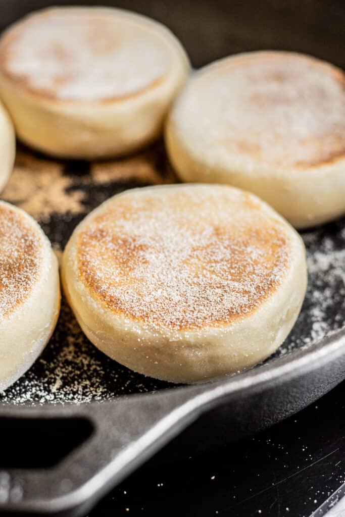 cooked English muffins in skillet.
