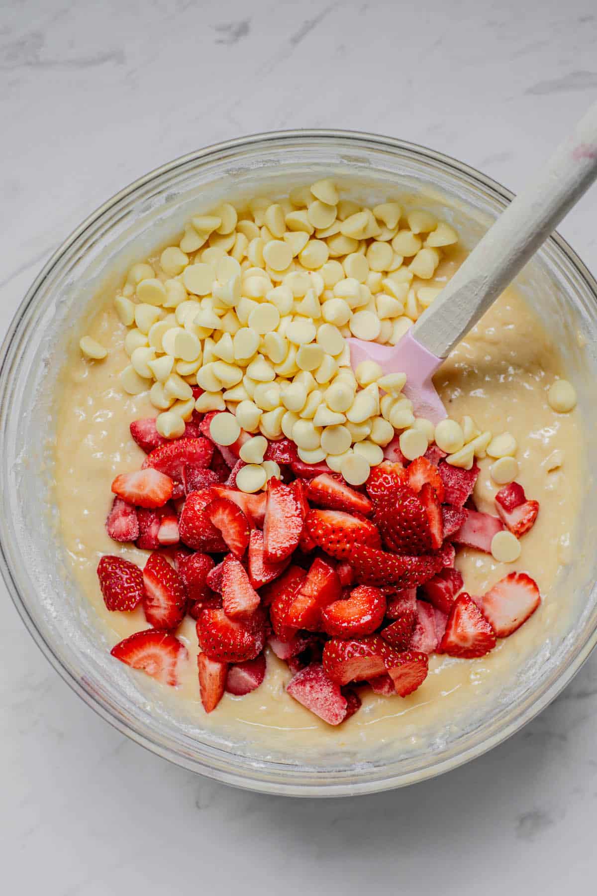 White chocolate and chopped strawberries in batter.
