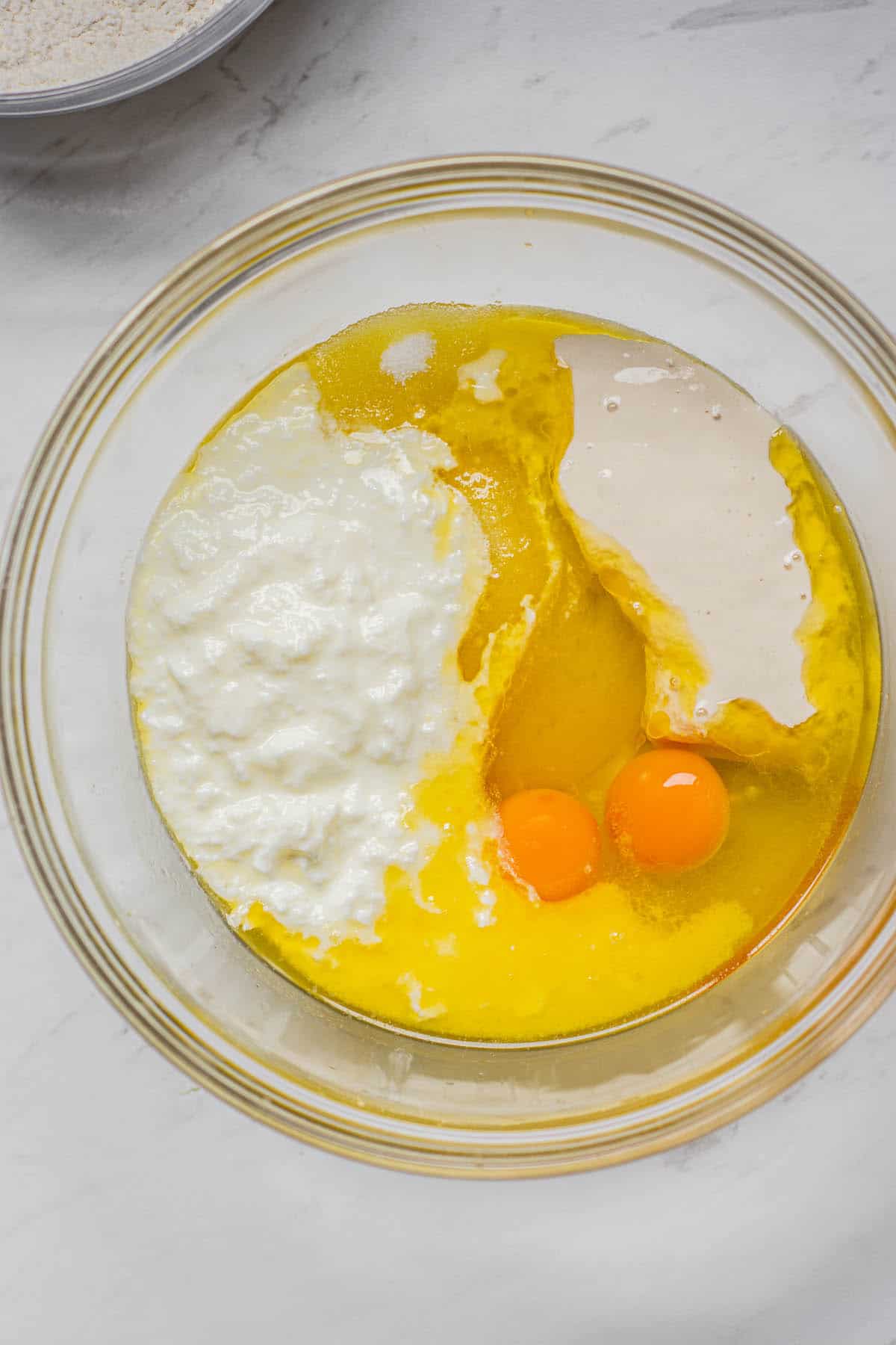 birds eye view of eggs, oil, butter and buttermilk.